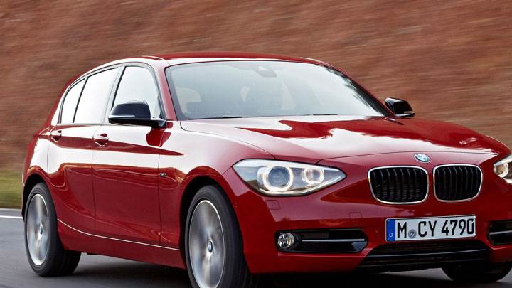 2012 BMW 1-Series On Highway Front Pose in Red